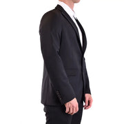 Black tailored wool blazer by Rrd men featuring notched lapels and three-button cuffs low cut v neck design