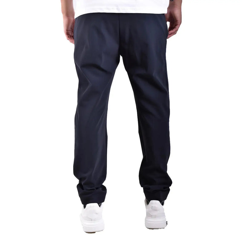 Dunkelblaue, schmal zulaufende Herren-Polyamidhose von rrd, die die Rückseite mit glattem, glänzendem Stoff und dezenten Bügelfalten zeigt.