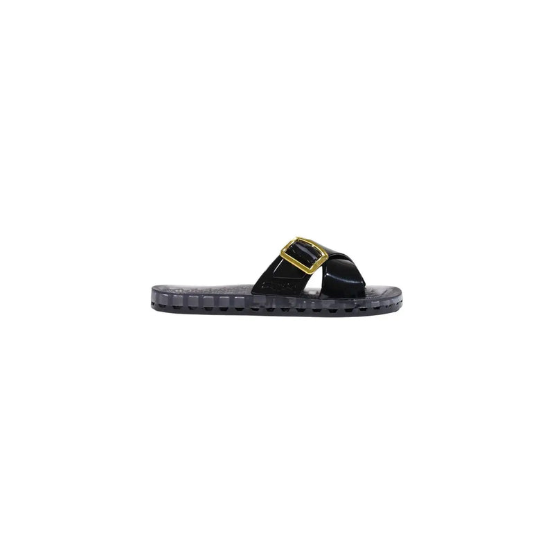 Schwarze, glänzende Riemchensandalen mit goldfarbener Schnalle und transparenter Gummisohle aus der Sensi Damen-Kollektion „Pink PVC Slipper Sorrento Flamingo“.