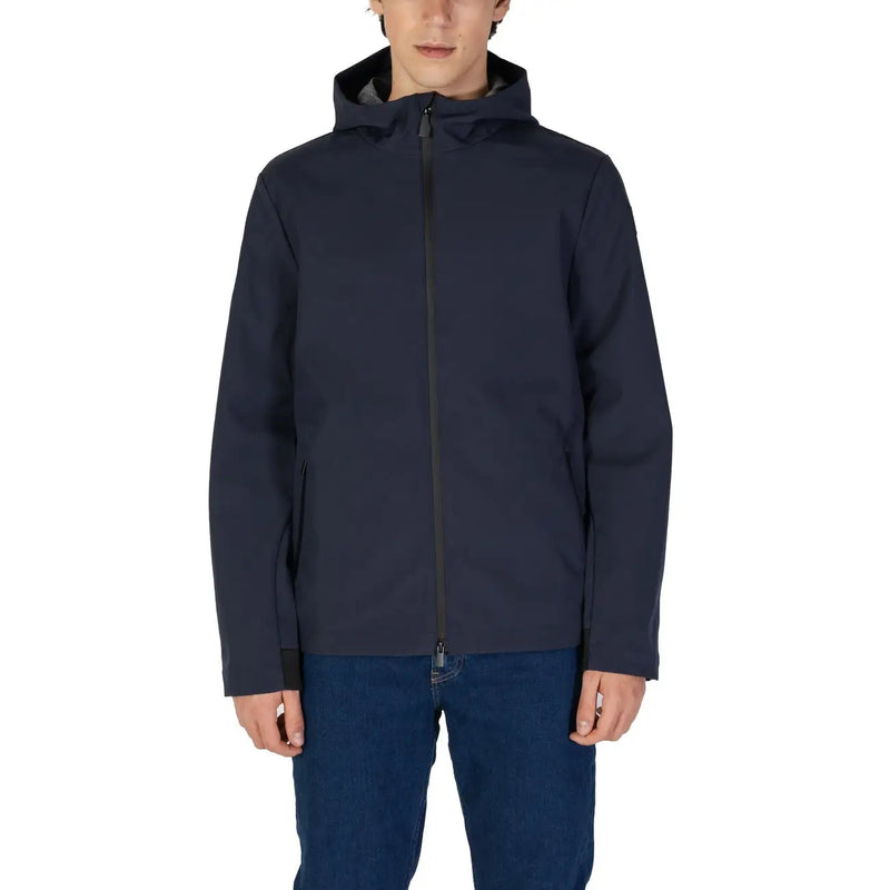 Men’s navy blue hooded zip blazer worn over blue jeans for fall winter style