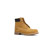 Timberland men’s brown leather slip on boots featuring tan 6 inch timberland boot with black collar and tan laces