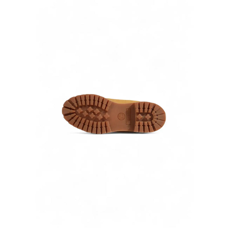 Timberland men’s brown leather slip on boots with tan leather upper and rugged textured rubber sole with diamond tread