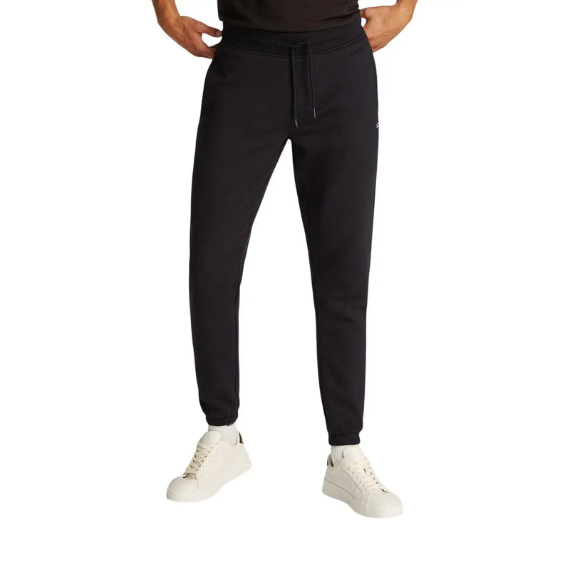 Schwarze, schmal geschnittene Jogginghose aus Baumwollfleece von Tommy Hilfiger mit Kordelzugbund und gerippten Bündchen aus weichem Fleecematerial