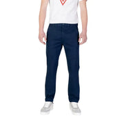 Navy blue Tommy Hilfiger men’s jeans trousers displayed on a neutral background