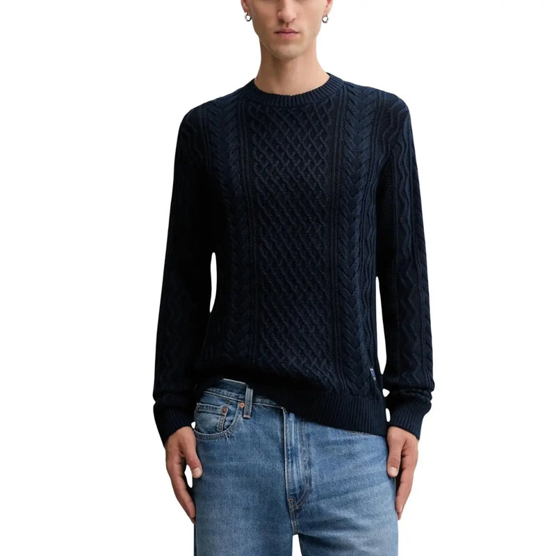Navy blue cable knit sweater with a crew neck and long sleeves.
