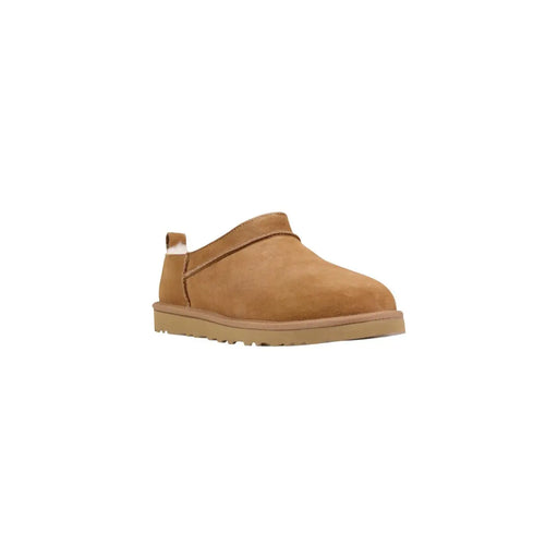 Tan suede ugg men slip-on shoe with soft white shearling lining and rubber sole for spring and summer use