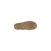 Tan rubber sole with starburst tread pattern and ugg logo embossed near the heel of ugg men slip on beige suede shoes