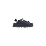 Schwarze Ugg Damen-Plateausandalen aus Polyurethan mit klobiger Sohle und dekorativen Kettendetails – ideal für den Frühling.