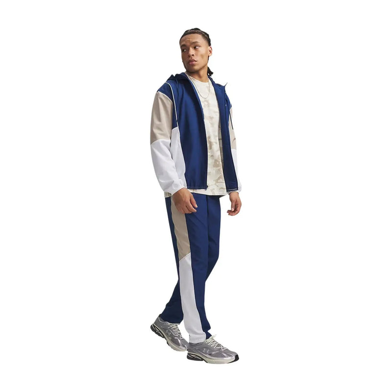 Under armour Herren-Trainingsanzug aus blauem Polyestergewebe mit weiß-blauem, farblich abgesetztem Kapuzenpullover mit kontrastierenden Einsätzen und Streifen