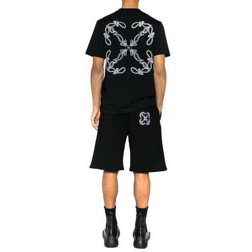 Off-white Männer t-shirt Rückansicht: Schwarzes Kurzarmhemd mit aufwendigem, weiß gesticktem Blumenmuster und passender Shorts-Emblem