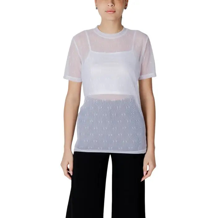 Woman wearing a sheer top with a white tank top underneath in the Women’s Sheer Top with White Tank product image